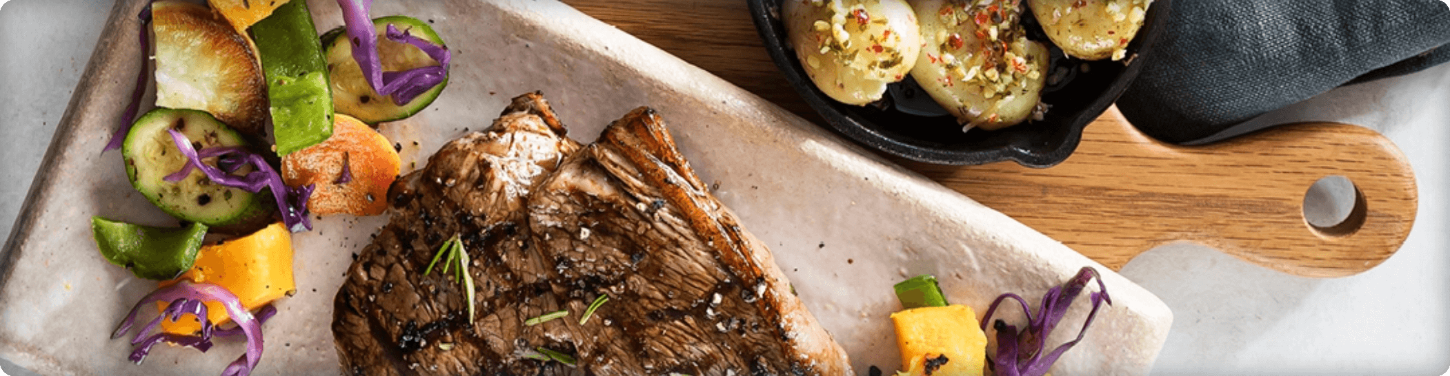 Rump steak on a wooden board, illustrating payment methods with quality food