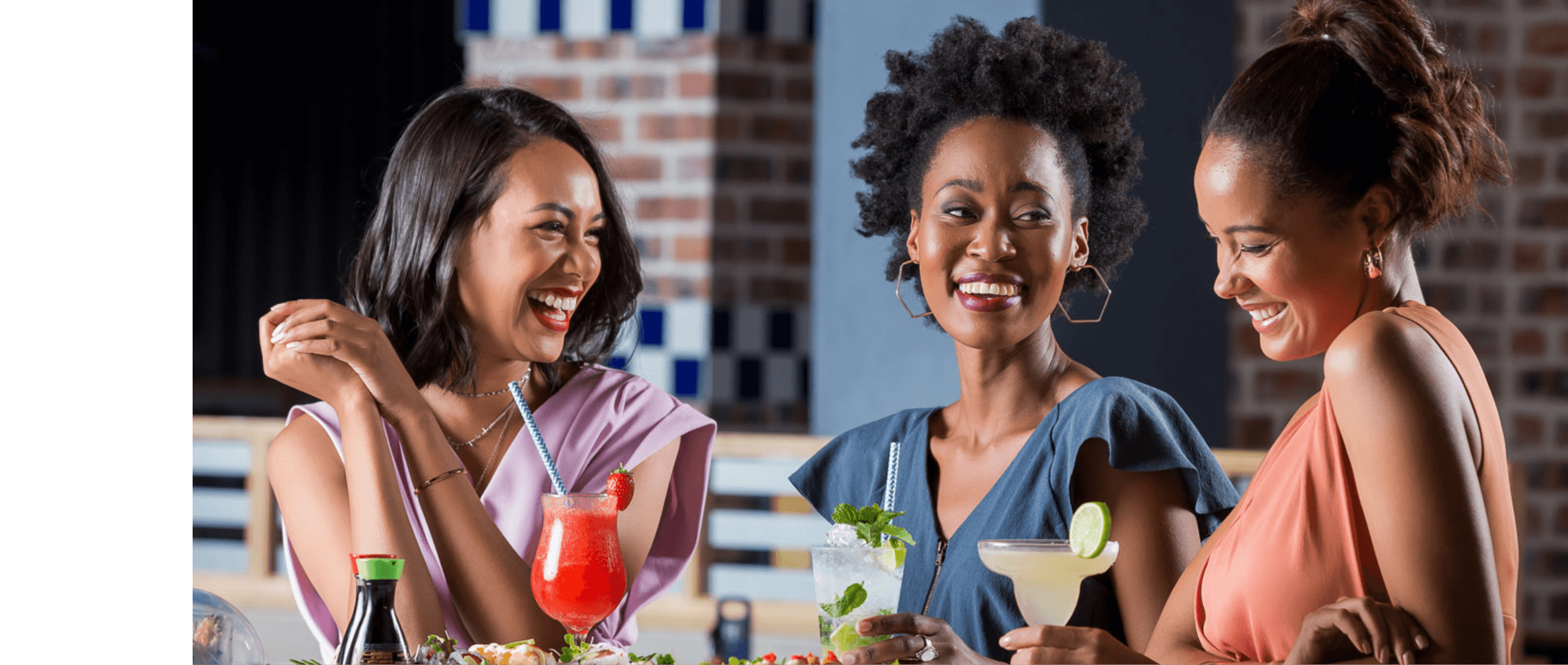 Three women smiling appreciating the value of the vouchers